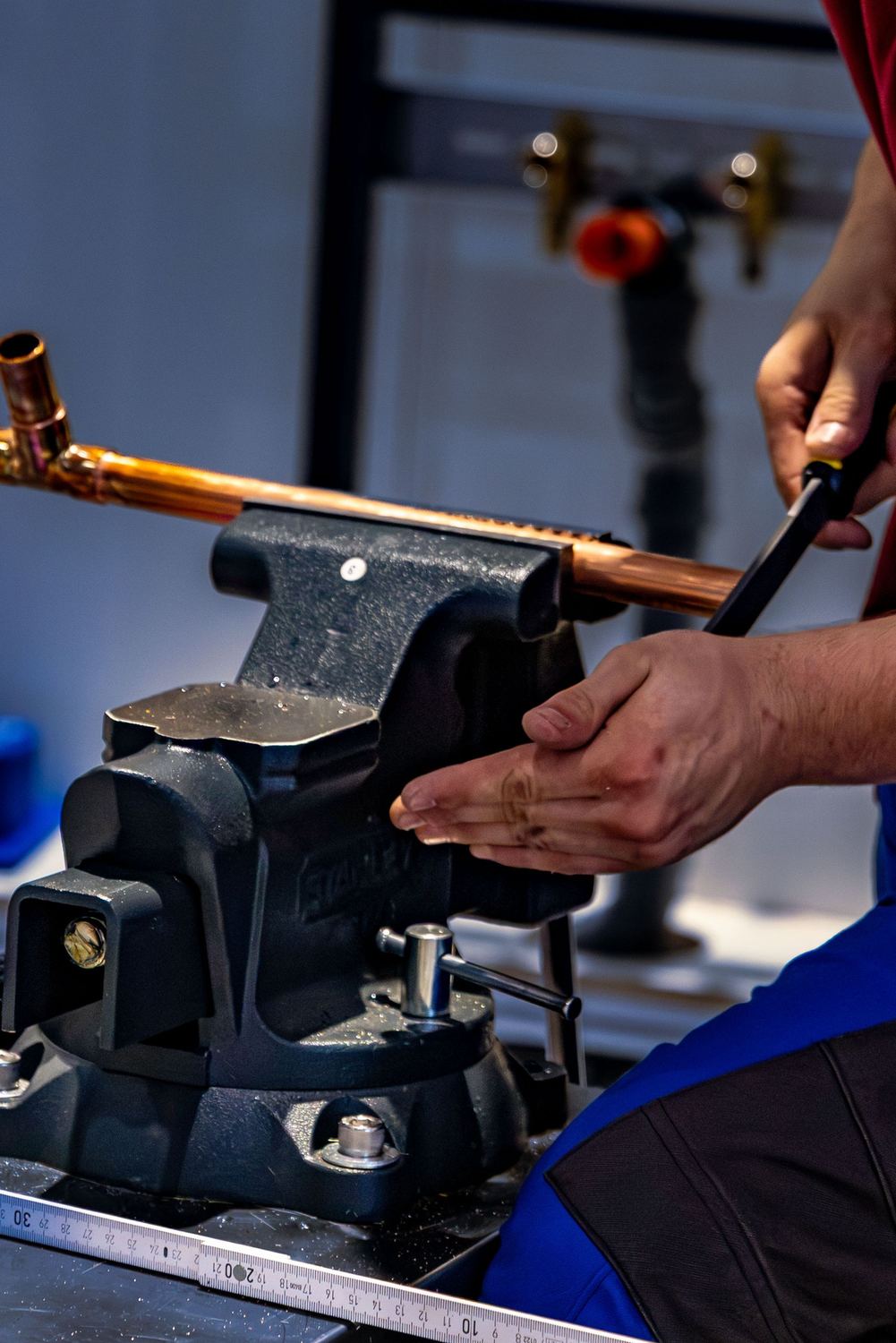 Plumber bending new copper pipe for a repipe job
