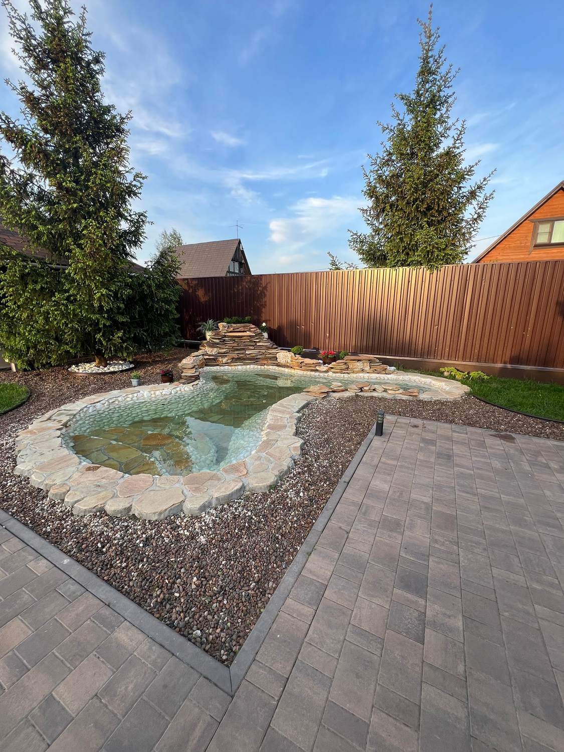 Pond, pavers & privacy fence in Cary
